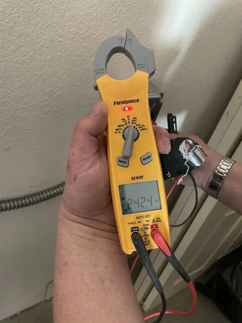 Voltage testing with clamp meter during Outlet Installation in Talty